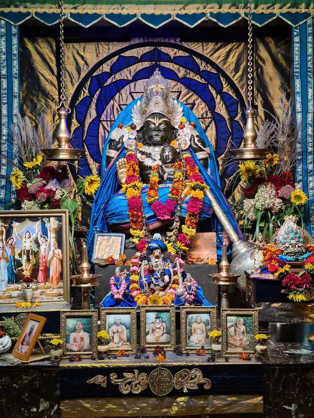 a statue of a person surrounded by flowers