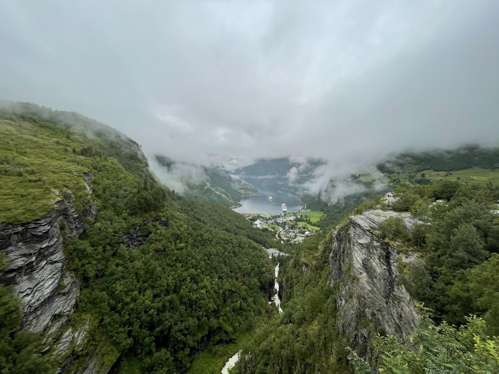 a view of a valley with a waterfall in the middle of it