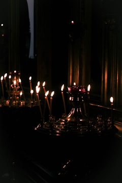 A serene living room with softly glowing candles on a table.