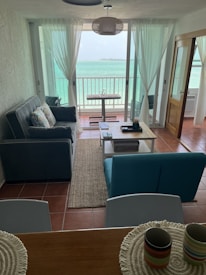 Modern flat interior featuring a comfortable living area with coastal decor.