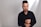 a man in a black shirt is posing for a picture