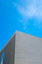 Luxury minimalist building exterior with navy blue and golden accents in Beaumont, Texas.