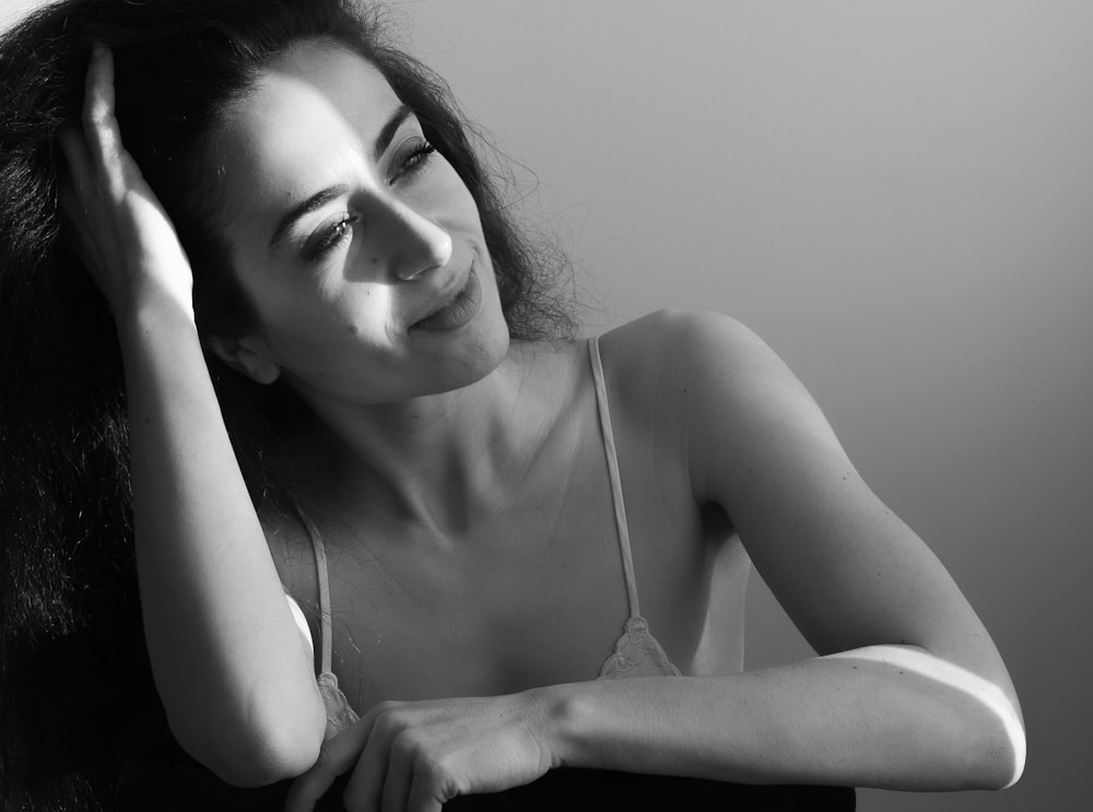 a black and white photo of a woman with long hair