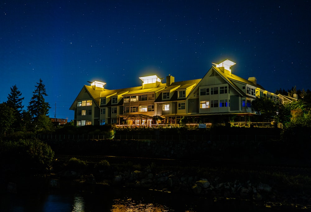 a large building with a lot of windows lit up at night