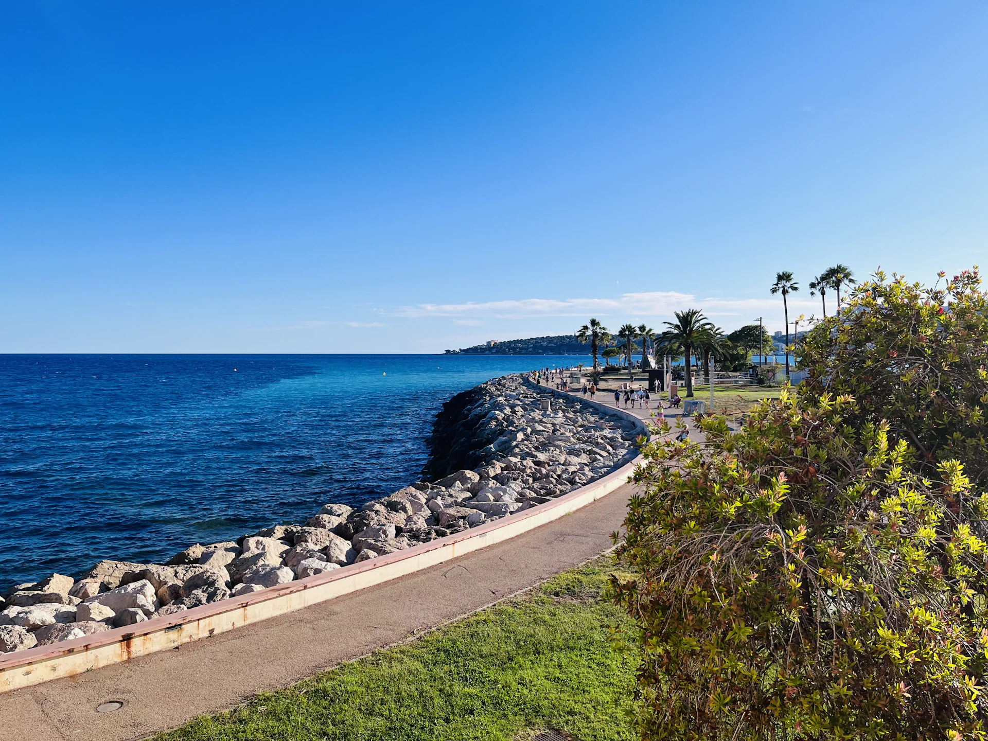 a view of the ocean from a walkway