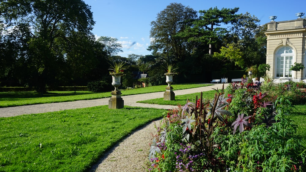 a garden with a path leading to a building