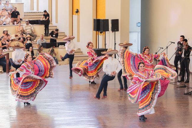 a group of people that are dancing in a room