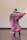 Close-up of flamenco dancer's feet tapping on wooden floor, vibrant red skirt swirling.