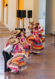 Group of dancers in traditional Franciscan-inspired costumes at the festival.