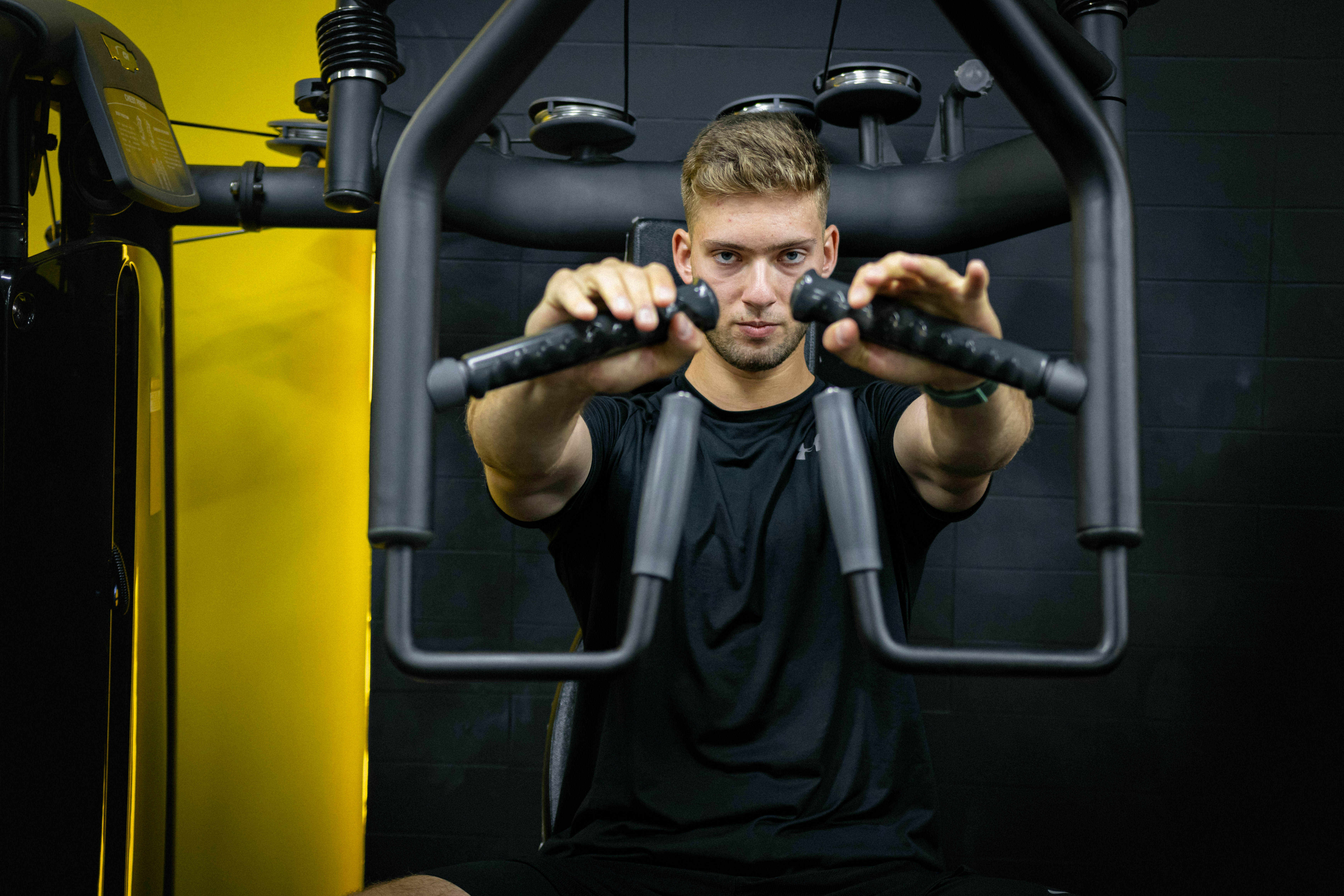 a man is doing exercises on a machine