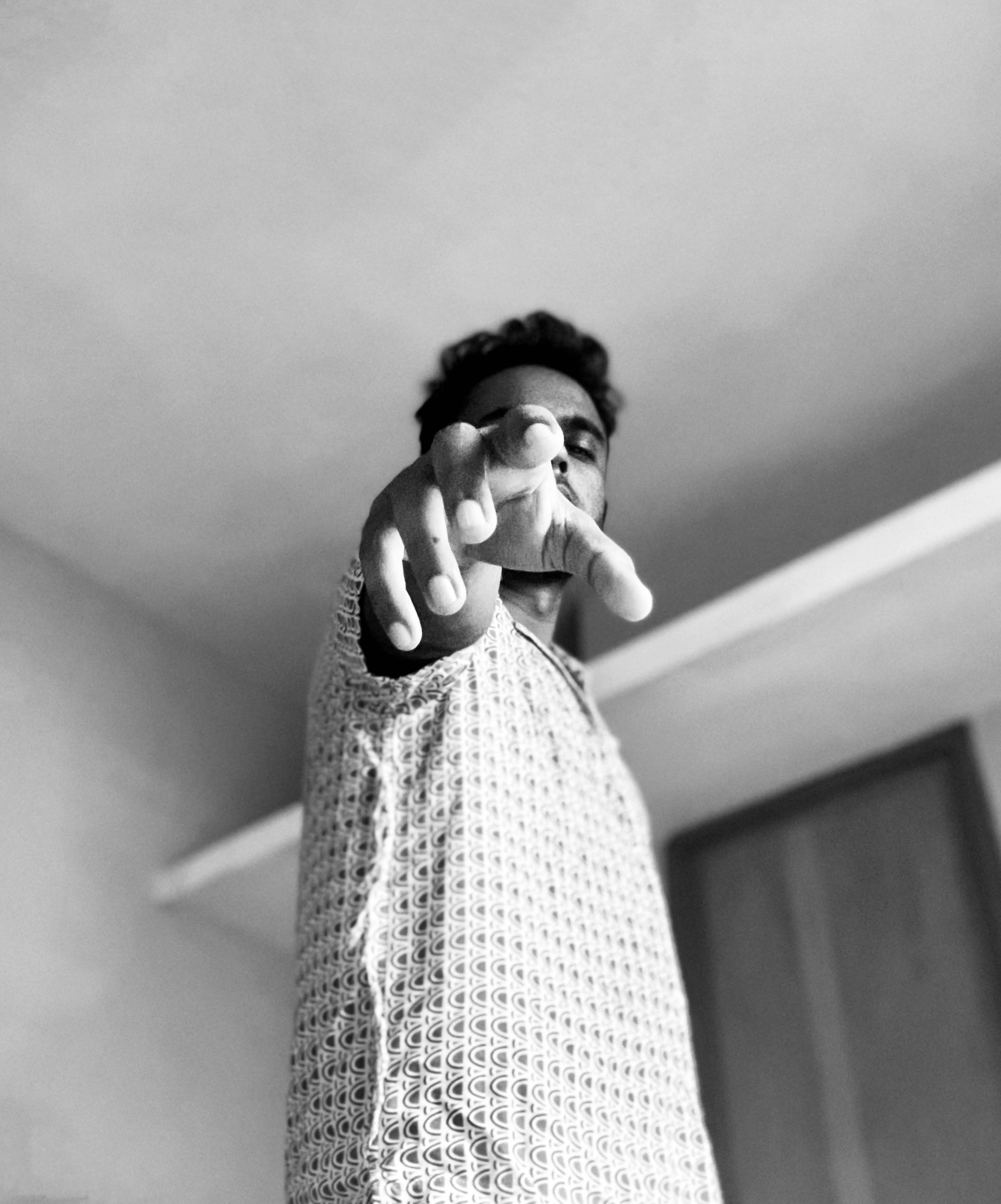 a man pointing a finger at the camera