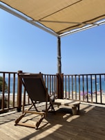 The spacious deck with lounge chairs overlooking the beach.