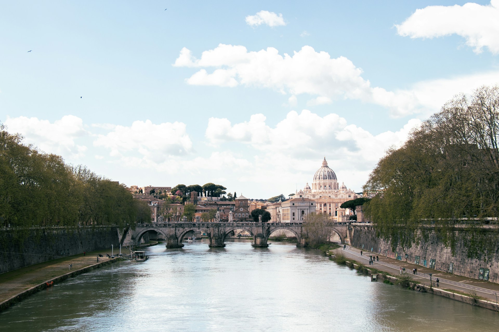 a river running through a city next to a bridge
