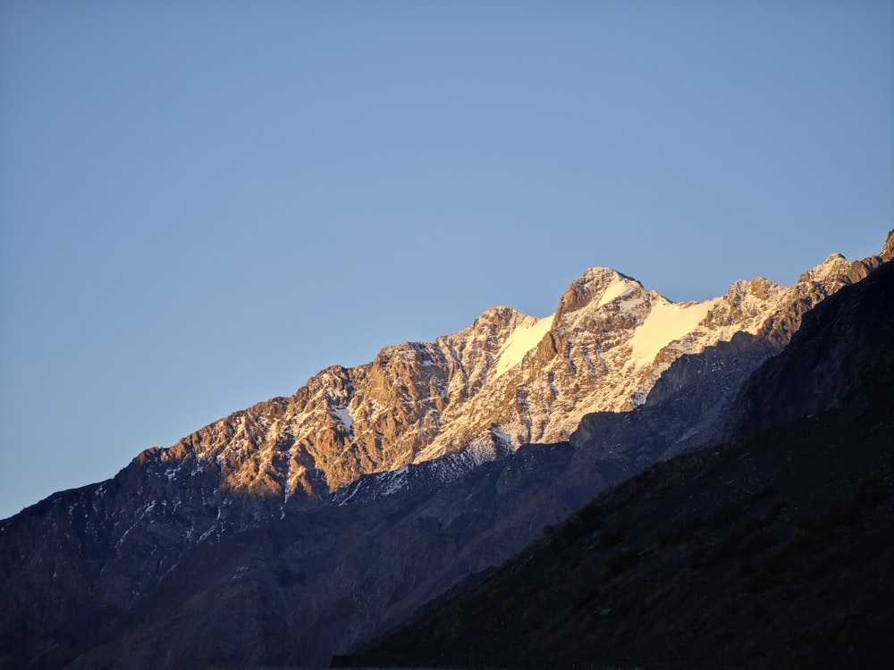 a view of a mountain with snow on it