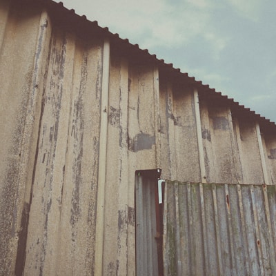 a building with a metal roof and a metal door