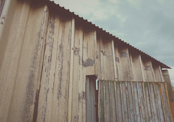 a building with a metal roof and a metal door