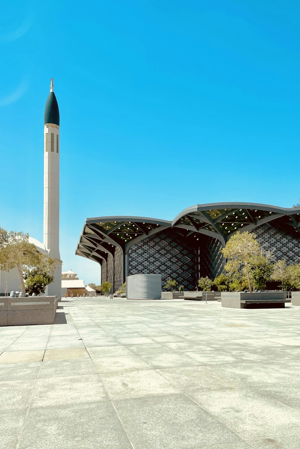 a large building with a tall tower in the background