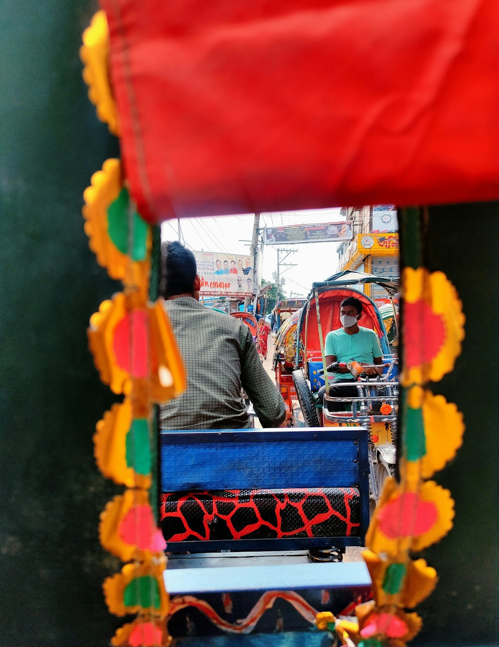 a man and a woman are riding on a cart
