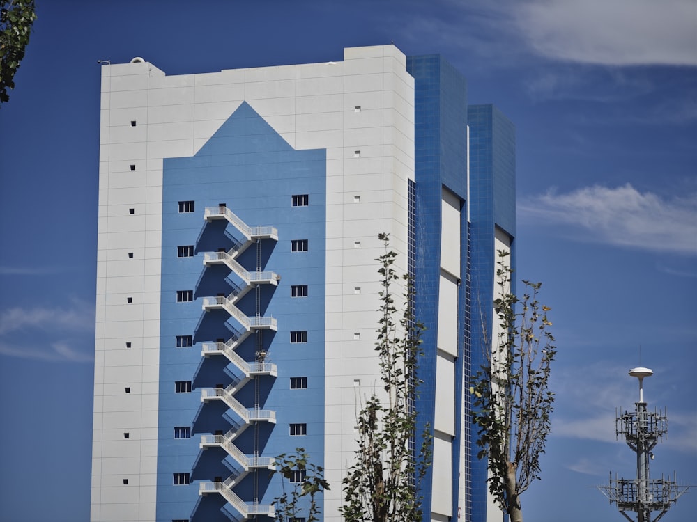a tall building with a blue and white design on it