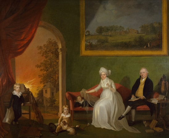 A historical painting featuring a family sitting in a room with green walls. A woman in white is seated on a red sofa, holding a veil over a child lying beside her. A man dressed in dark clothing sits on the other side, near a table with books. A young boy in dark clothing stands next to a musical instrument. A small child with a dog is on the floor in front of the sofa. In the background, there is a large window showing a landscape with trees and a building. A large painting on the wall depicts an outdoor scene.