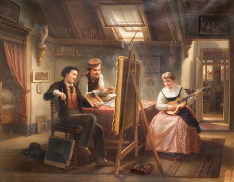 A cozy attic studio with three individuals: an artist, an assistant, and a woman playing a guitar. The artist is seated, holding a palette and brush, as he paints on a canvas positioned on an easel. The assistant stands nearby, observing the canvas, wearing a cap. The woman in a long pink dress plays a guitar, seemingly providing inspiration or entertainment. The room is well-lit by a skylight, with shelves lined with books, a curtain partially drawn, and various art supplies scattered around.
