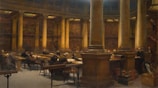 A spacious library with students reading and studying quietly.