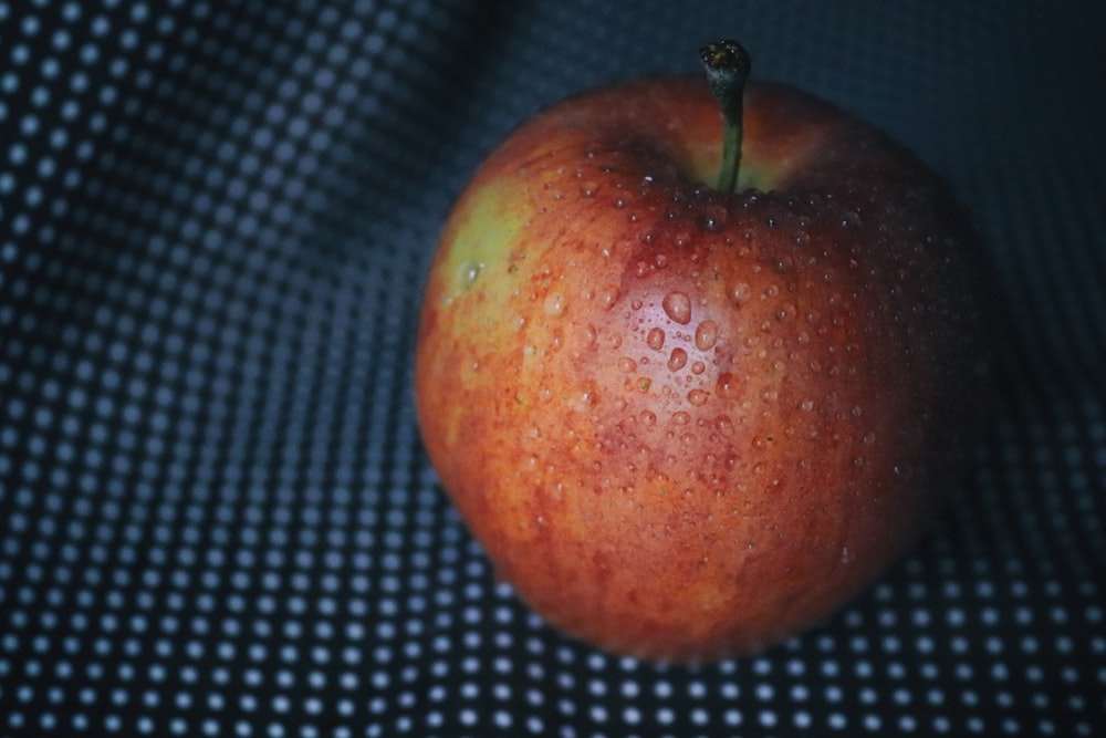 a close up of an apple on a cloth
