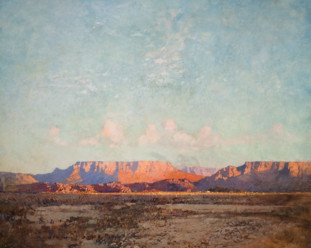 a painting of a desert with mountains in the background