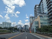 A modern cityscape of English residential buildings under a bright sky.