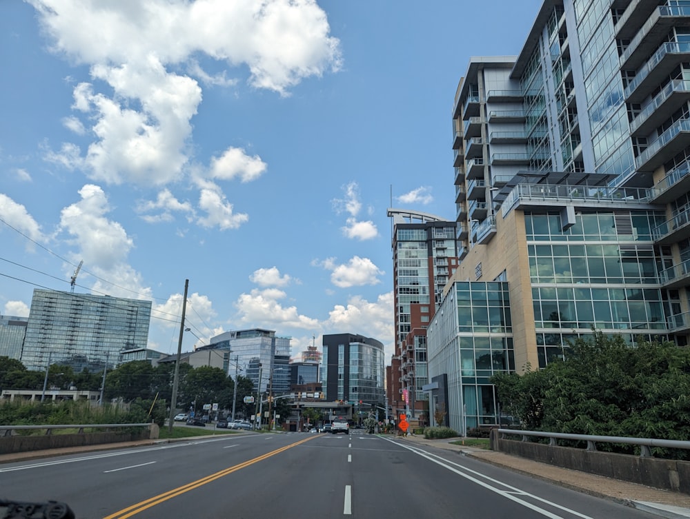 a view of a city street with tall buildings