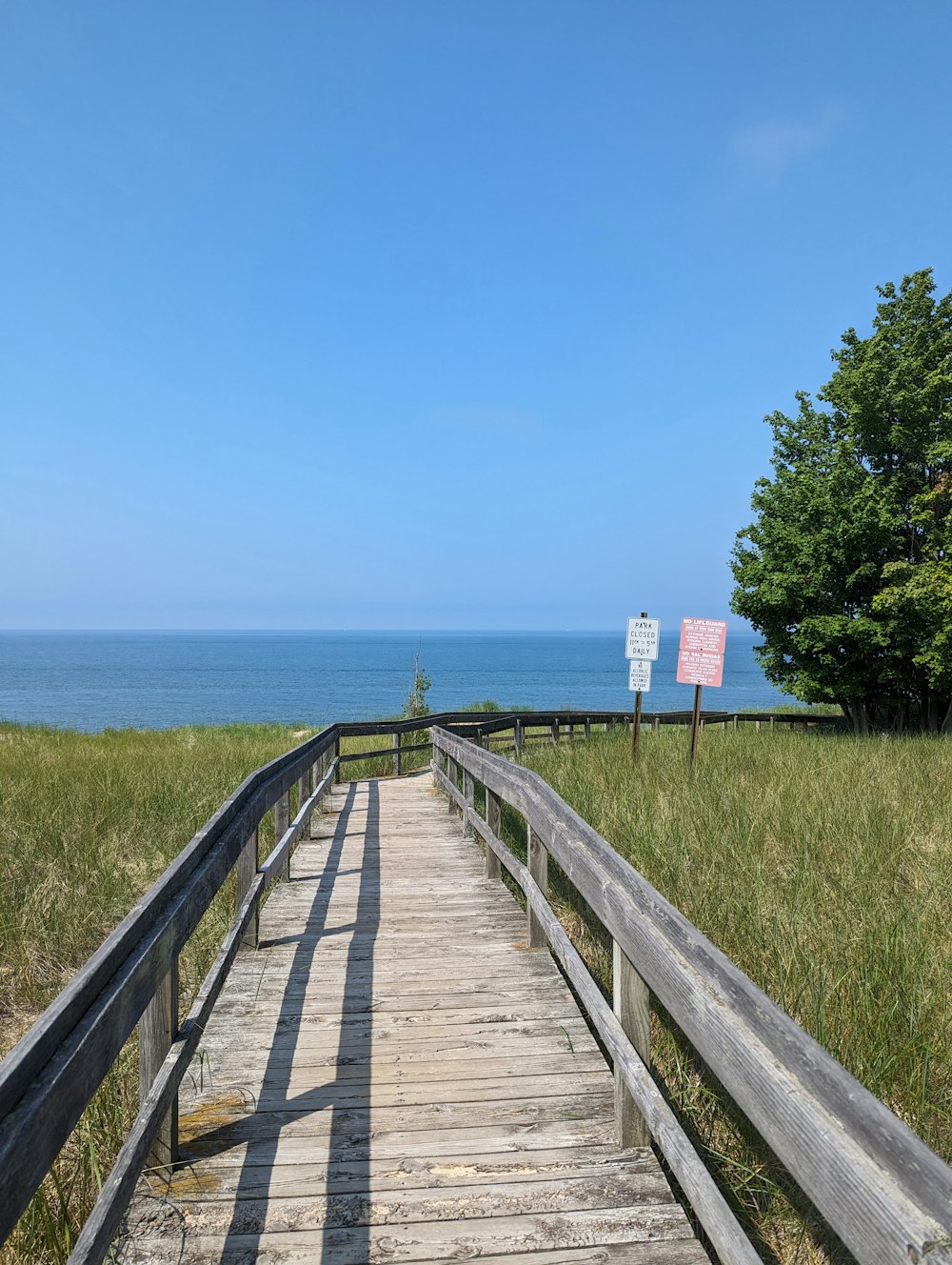 a wooden walkway leading to the beach