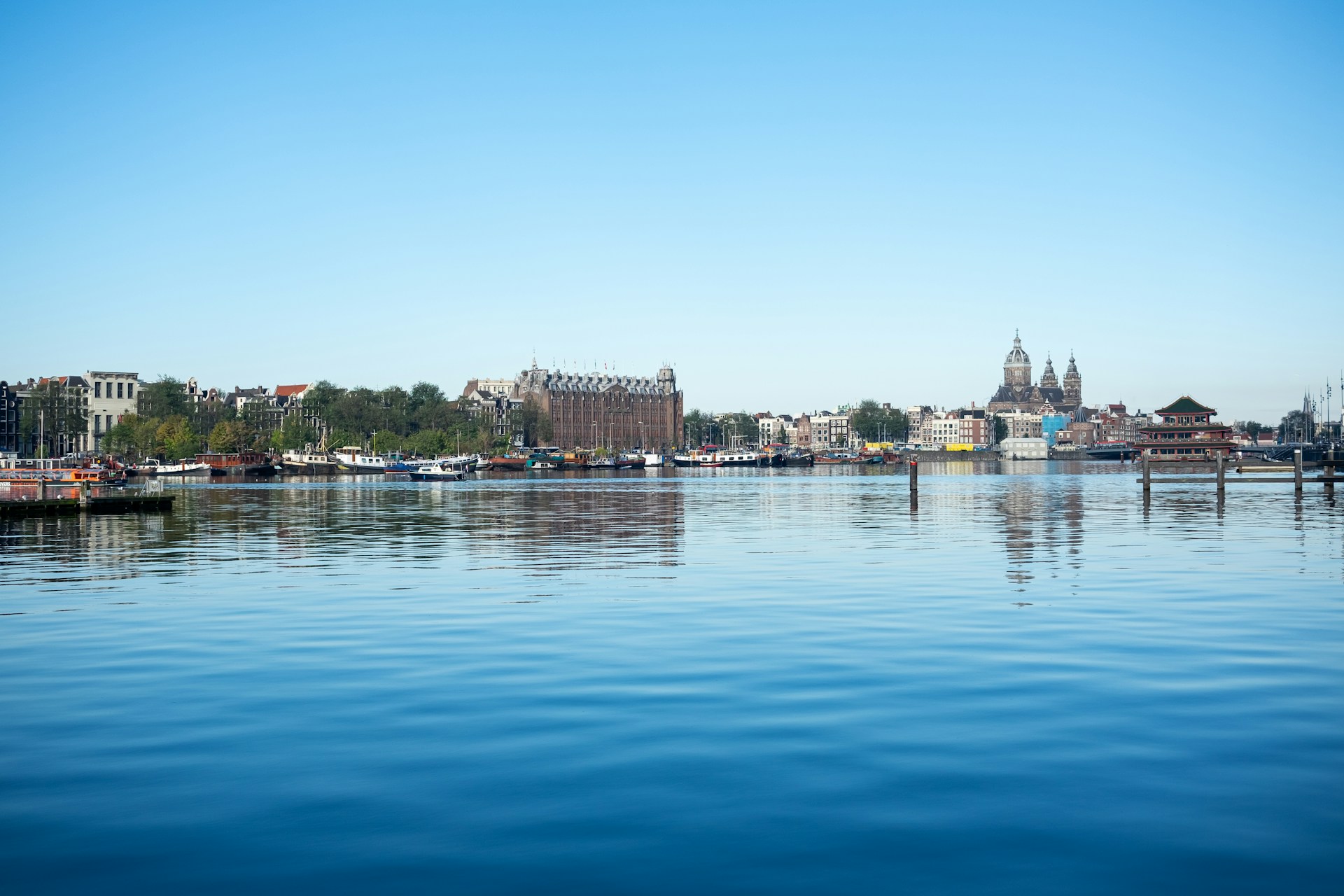 a body of water with a city in the background