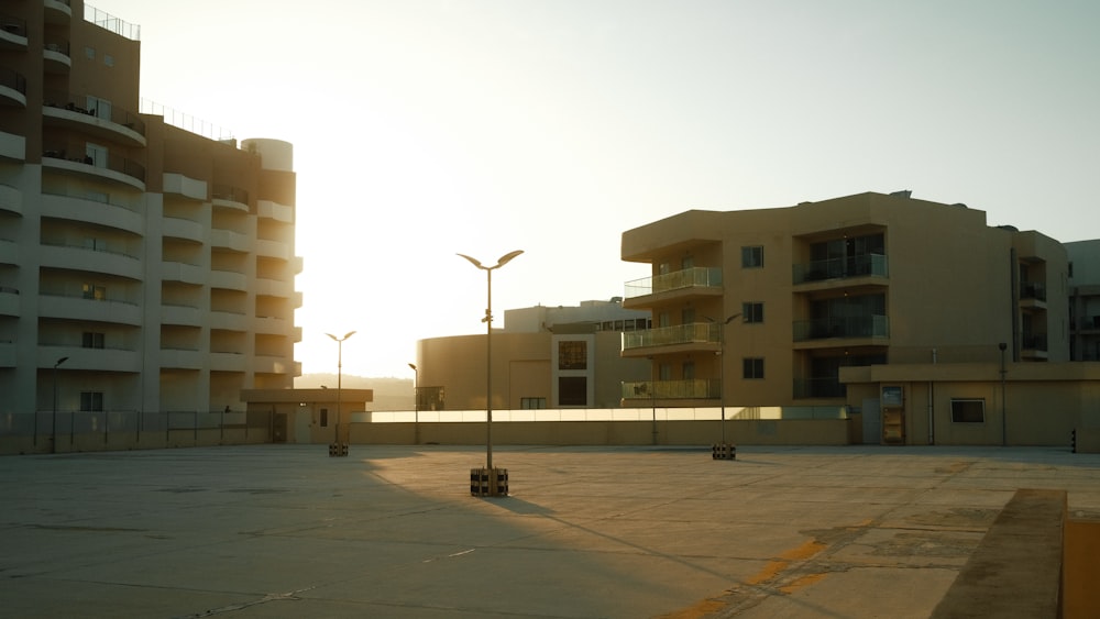 an empty parking lot in front of a building