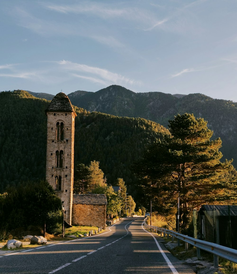 a tall tower sitting on the side of a road