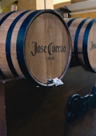three wooden barrels sitting on top of a table