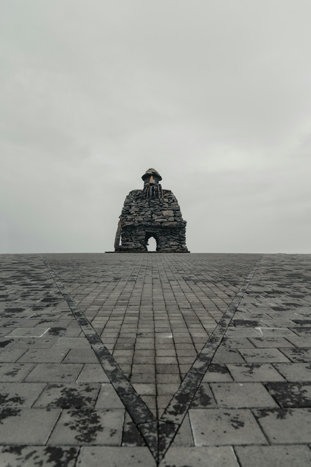 a person standing on top of a large stone structure
