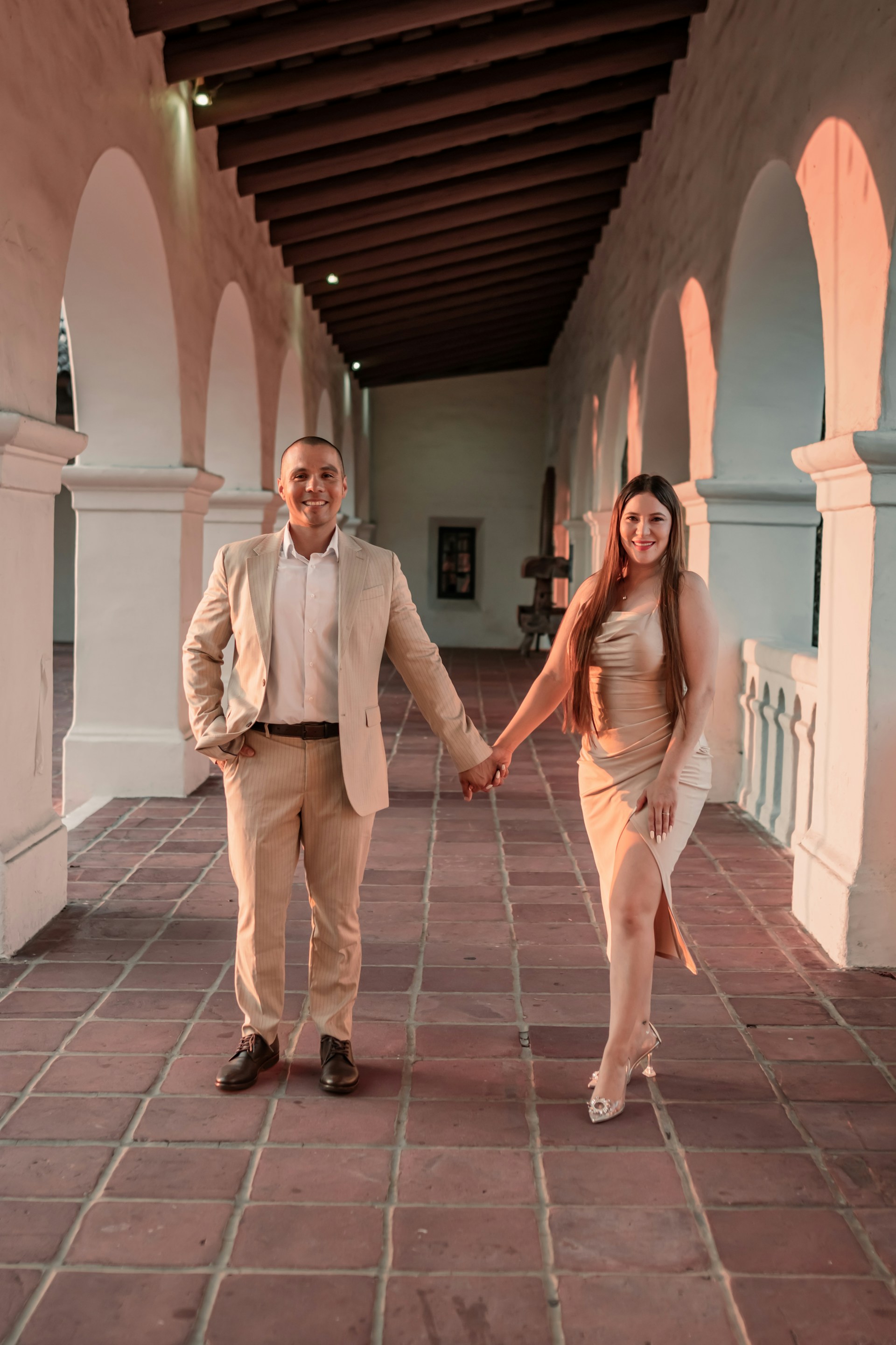 a man and a woman are holding hands