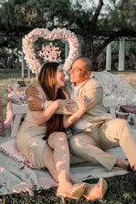 A cozy park picnic proposal scene with a vintage blanket, candles, and a camera ready to capture the moment.