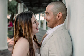 A smiling couple engaged in a heartfelt discussion during a session.