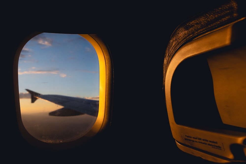 a view of the wing of an airplane through a window