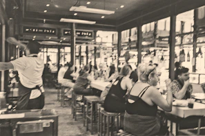 Happy customers enjoying their meals and chatting in the lively atmosphere of the cafe