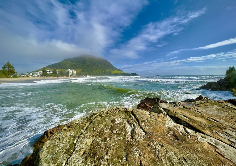 a view of the ocean from a rocky shore