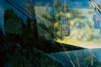 Close-up of a stylish air freshener releasing a soft mist in a sunlit kitchen.