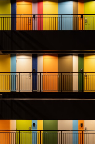 A collage of hostel facades showcasing diverse styles and welcoming entrances.