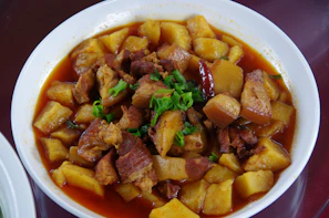Traditional Polish goulash with tender meat chunks and rich sauce.