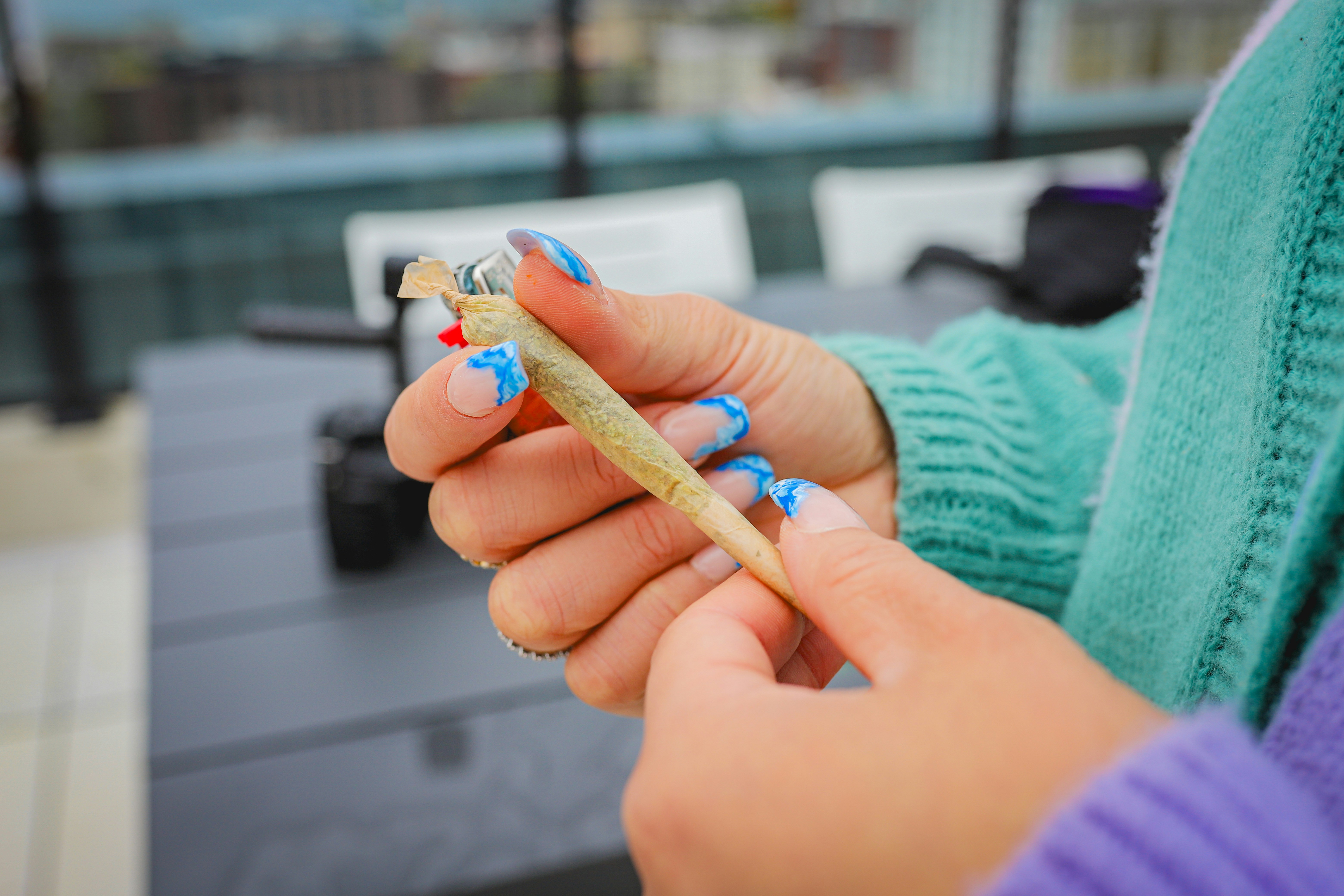 girl holding joint by LexScope