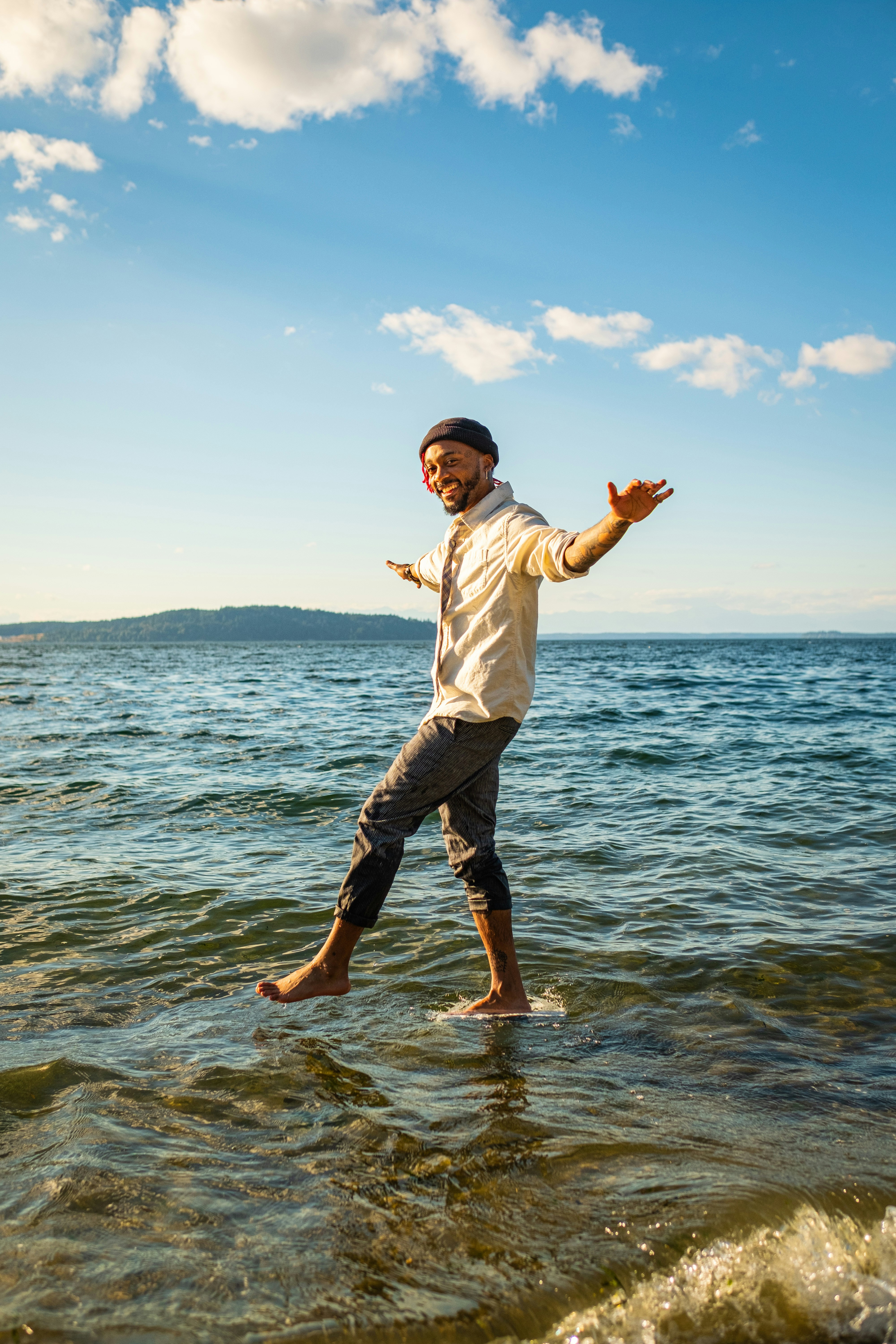 a man standing on a surfboard in the ocean