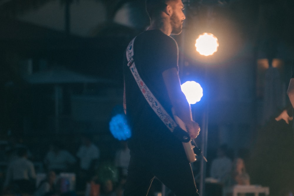 a couple of men standing next to each other on a stage