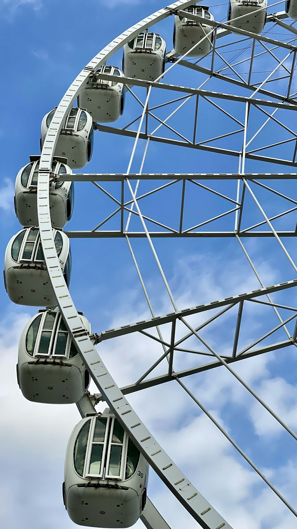 a ferris wheel is shown against a blue sky