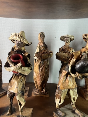 Small handcrafted wooden sculptures reflecting Chilean cultural motifs.